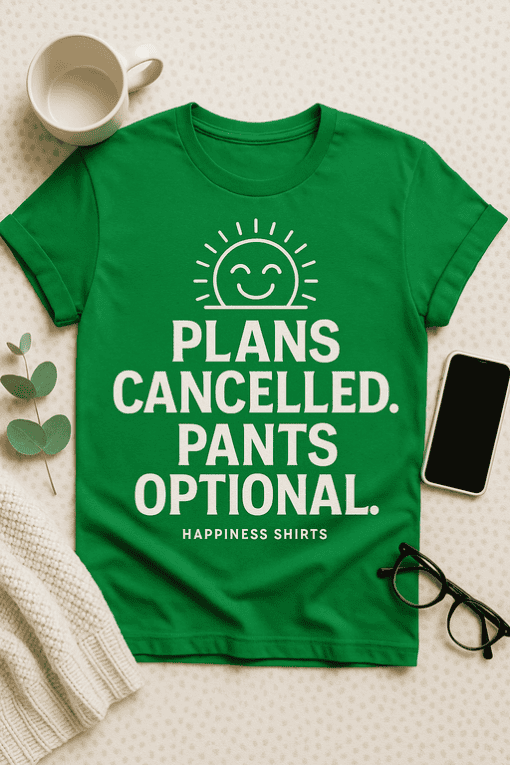 - Cheerful green T-shirt with funny "Plans Cancelled" slogan and happy sun graphic.